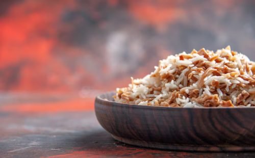 front-view-cooked-rice-with-dough-slices-dark-surface-dish-meal-dark-food-photo_140725-81860
