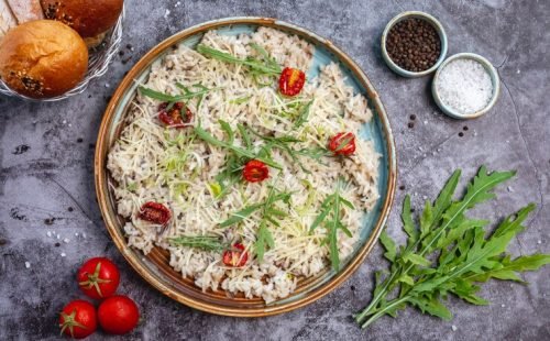 top-view-mushroom-risotto-garnished-with-shredded-cheese-dried-tomato-leaves_141793-2444 top-view-mushroom-risotto-garnished-with-shredded-cheese-dried-tomato-leaves_141793-2444